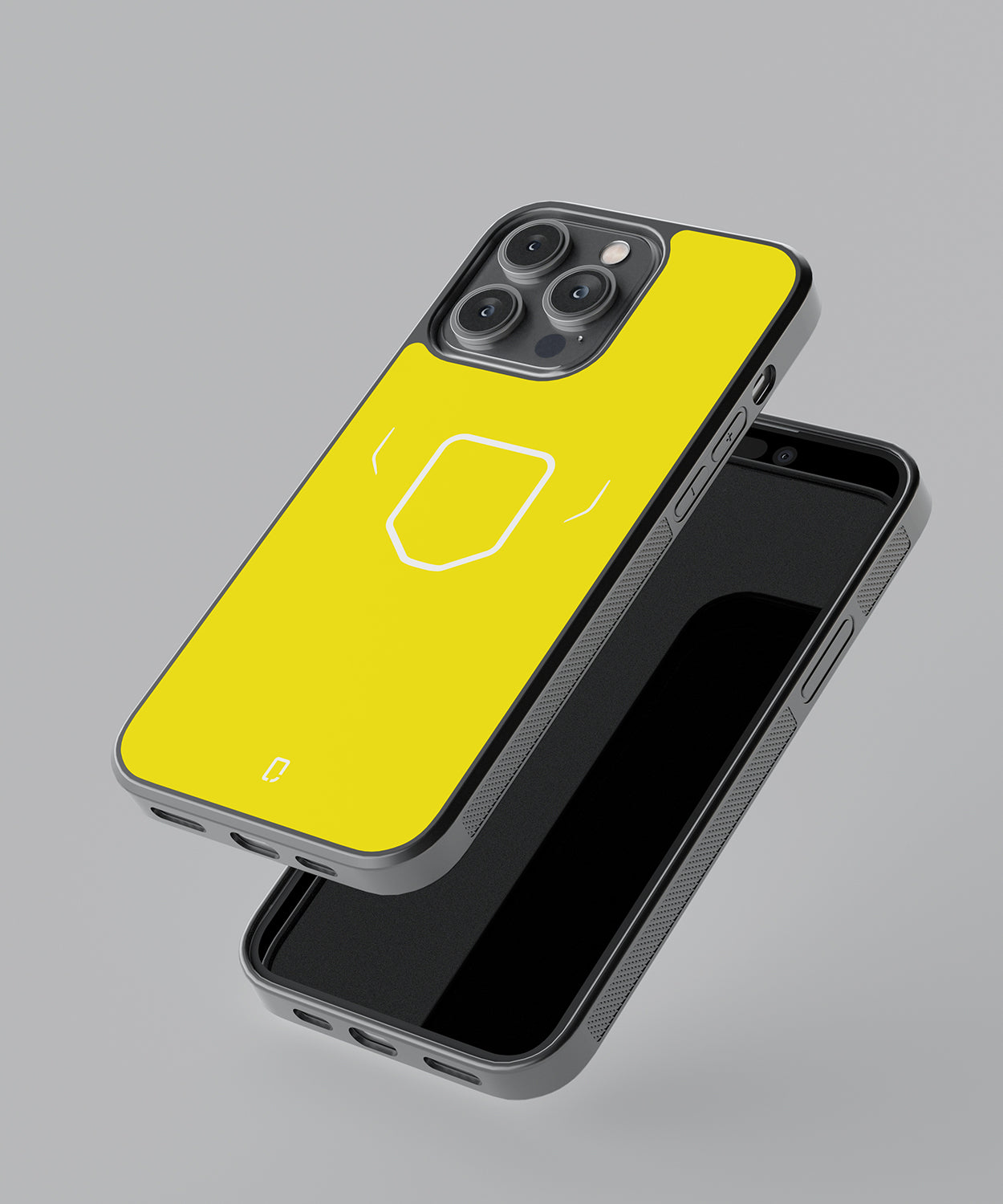 a yellow cell phone sitting on top of a cell phone 